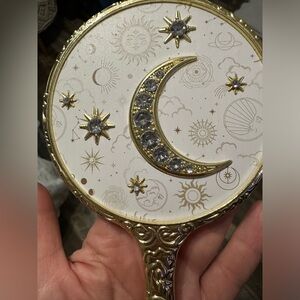 Mystical hand held mirror